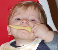 Nicholas eating baby corn